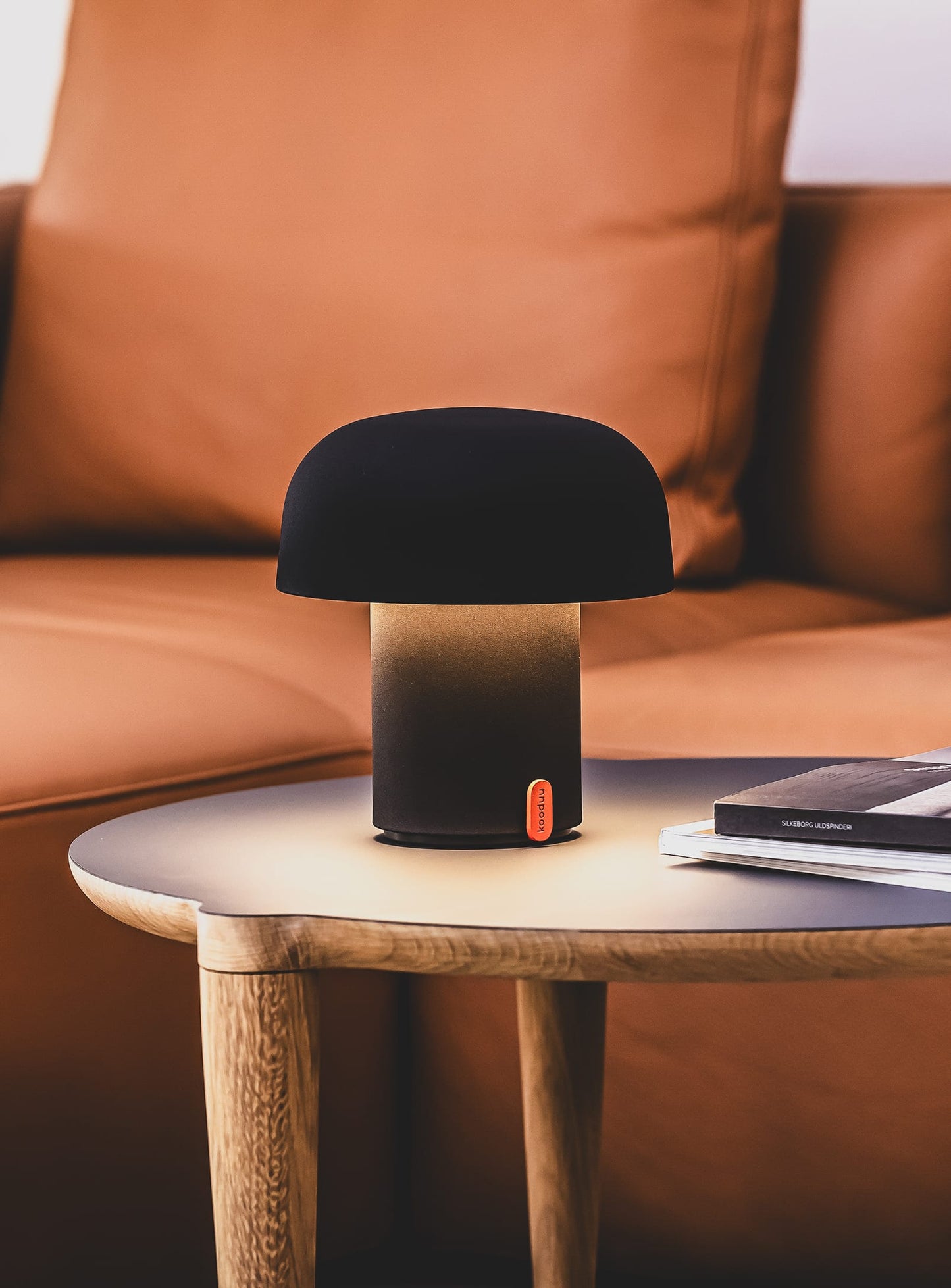 Sensa Anthracite by Kooduu – portable LED lamp with USB charging dock and dimmable lighting for versatile use.