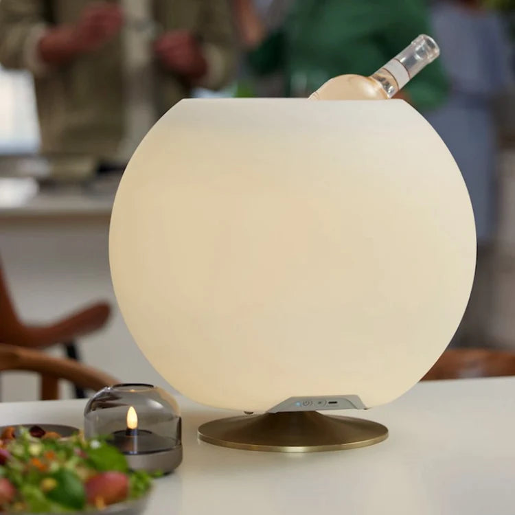 The Kooduu Sphere is the perfect addition to any living space. With its sleek design, dimmable light, balanced sound, and enough space for 2 bottles, this drinks cooler and speaker lamp is the ultimate all-in-one device.